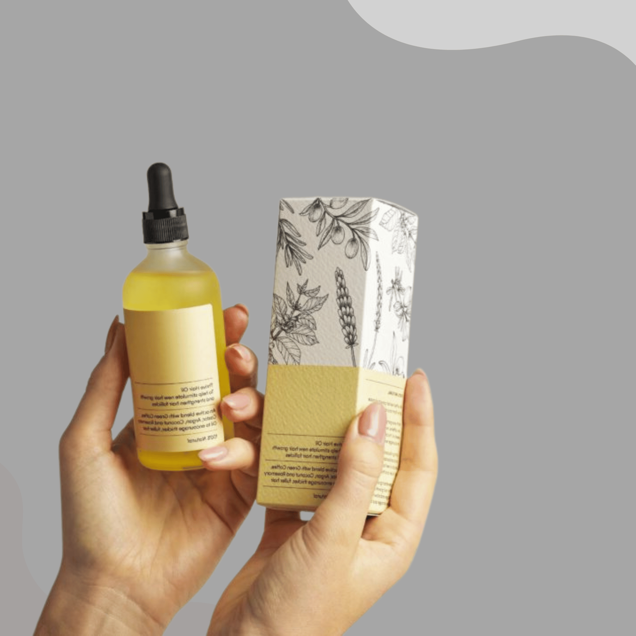 Hand holding Aglowra premium packaging for natural hair growth oil