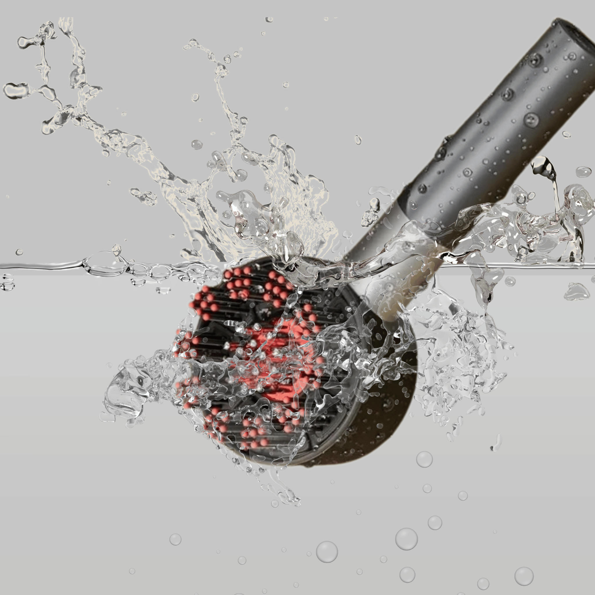 Aglowra red therapy brush being rinsed under running water to prove it is water resistant