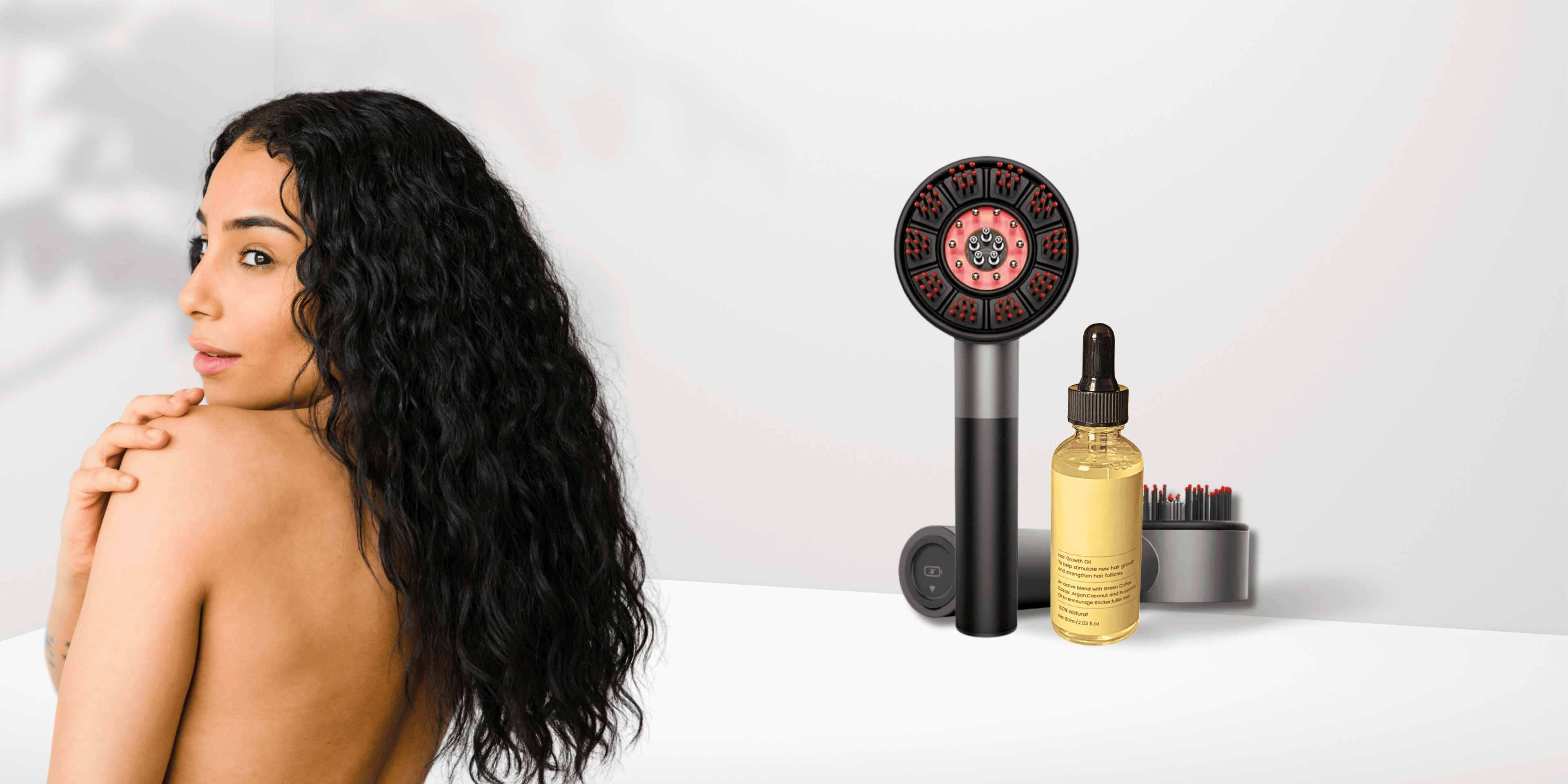 Woman with long, wavy hair on a white background with Aglowra Hair therapy tools