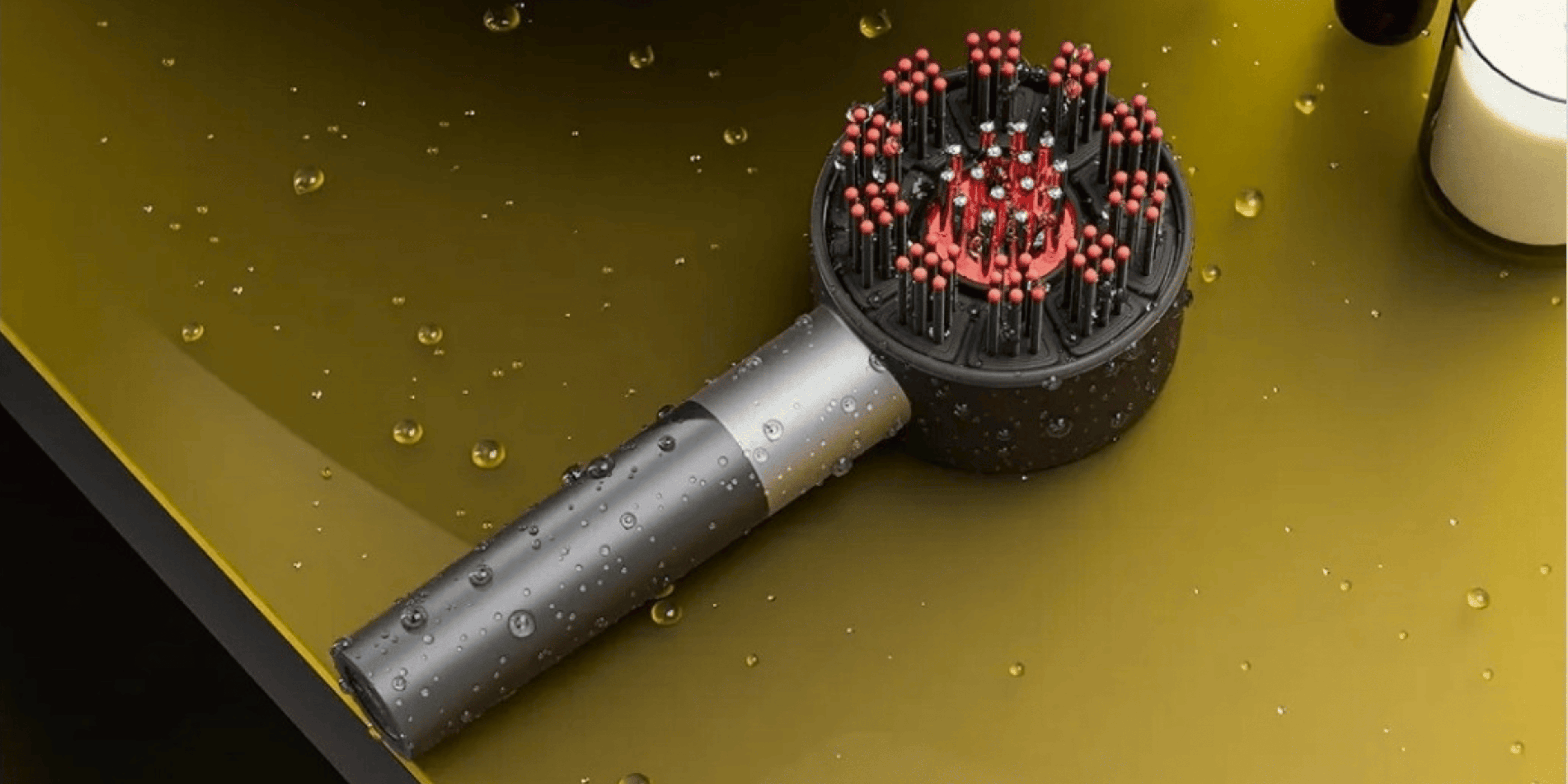 Display of water resistant red light therapy brush with water drops
